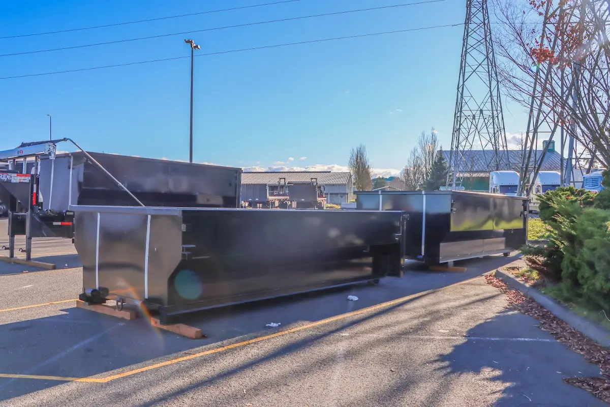 Roll-off dumpster ready for waste disposal at job site for 12 Yard Dumpster Rental in Milton